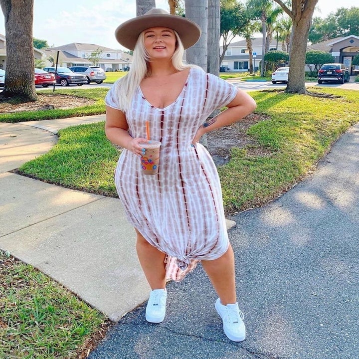 Reviewer wearing white dress