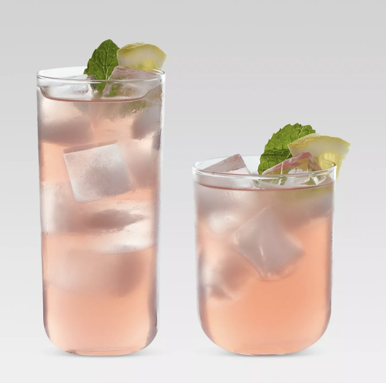 a tall tumbler and a short tumbler both holding a mixed cocktail