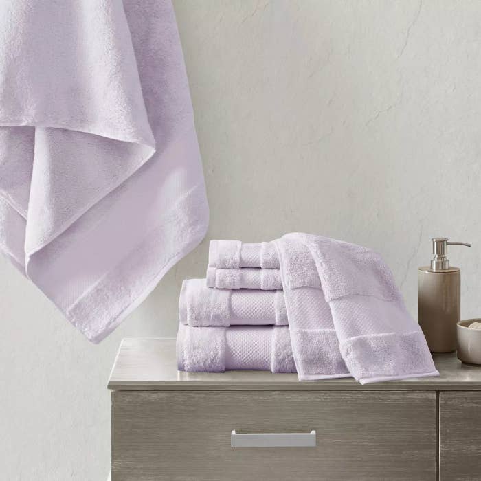 The towel set in lilac in a bathroom