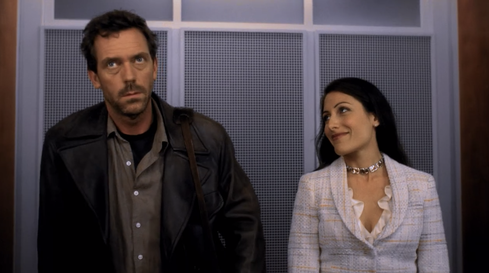 Dr. House and Dr. Cuddy ridding up in the elevator together 