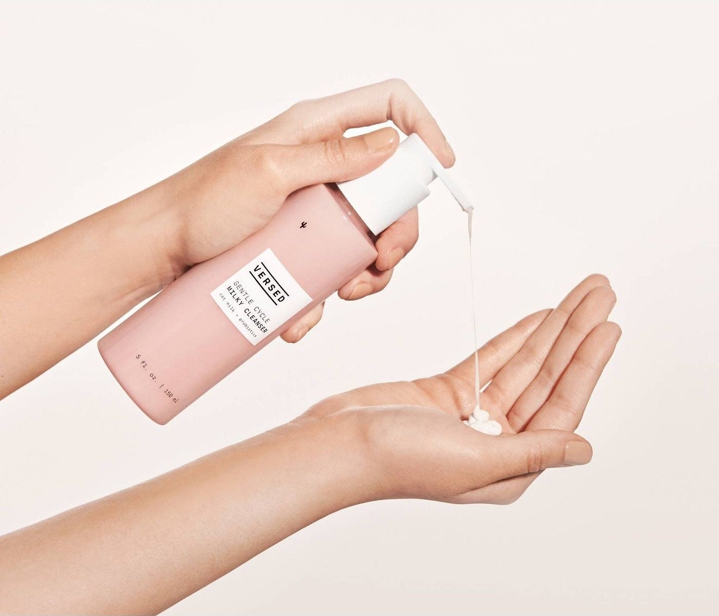 hand holding milky cleanser