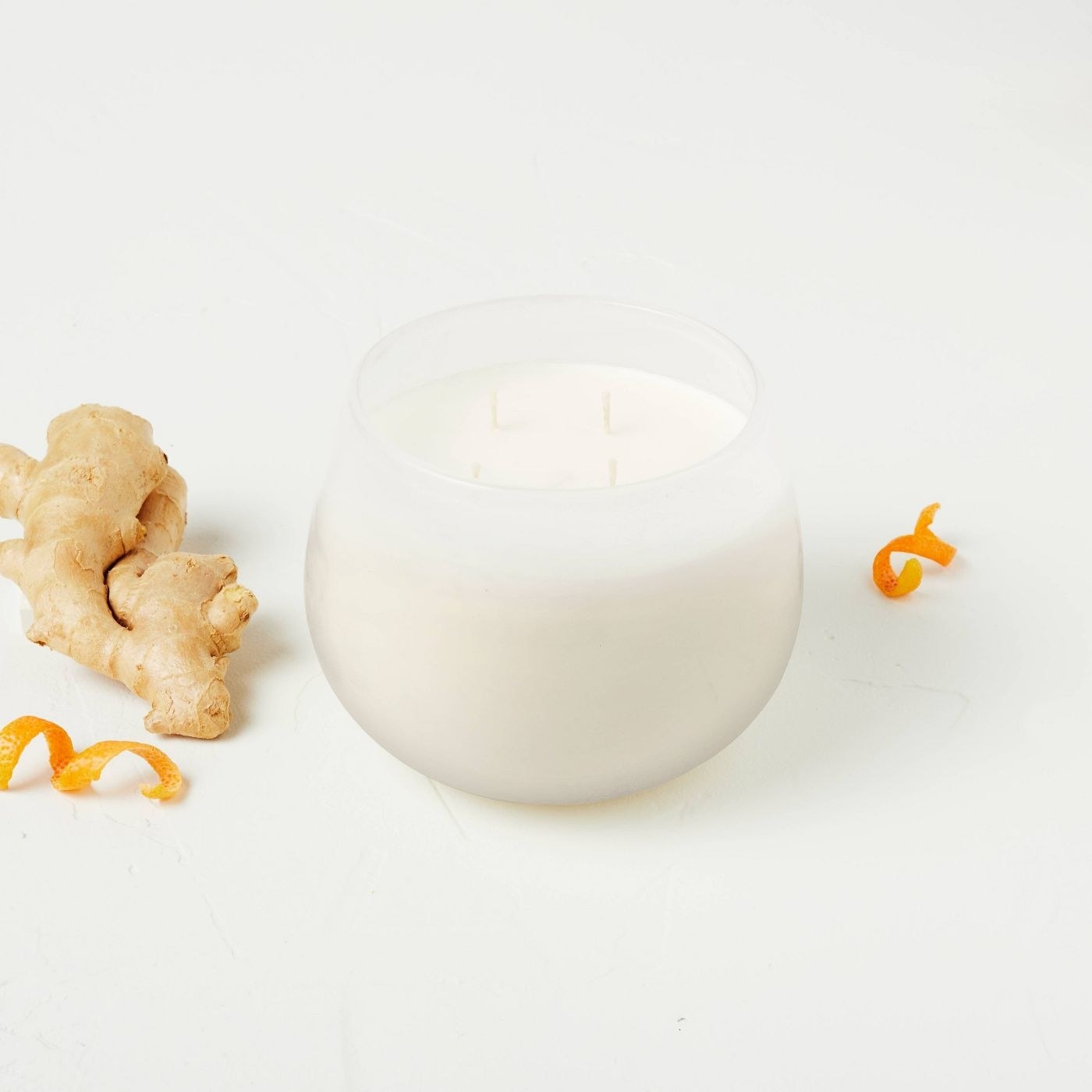 a white candle with four wicks