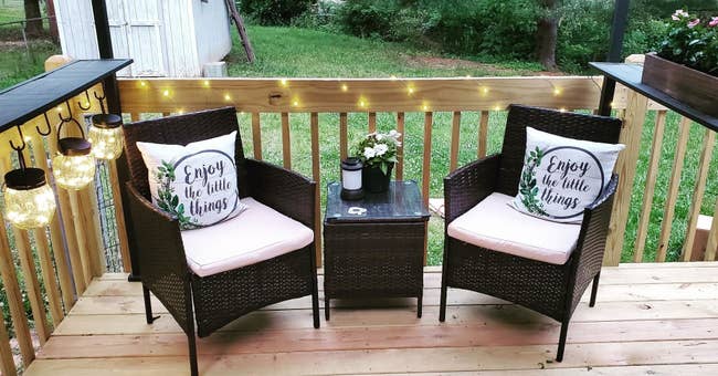 Three-piece dark brown rattan chairs with matching end table