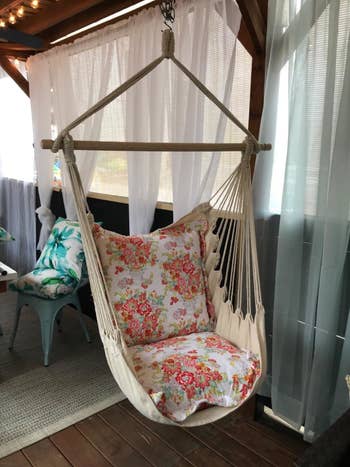 Reviewer photo of the chair with flower cushions added to it