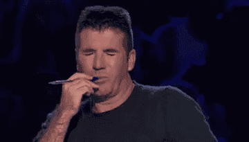 Simon Cowell making a disgusted face.
