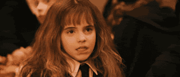 Hermione Granger looking upset and confused.