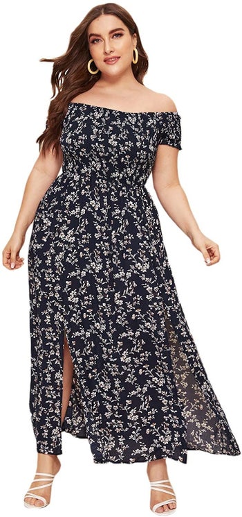 model wearing the black dress with floral pattern 