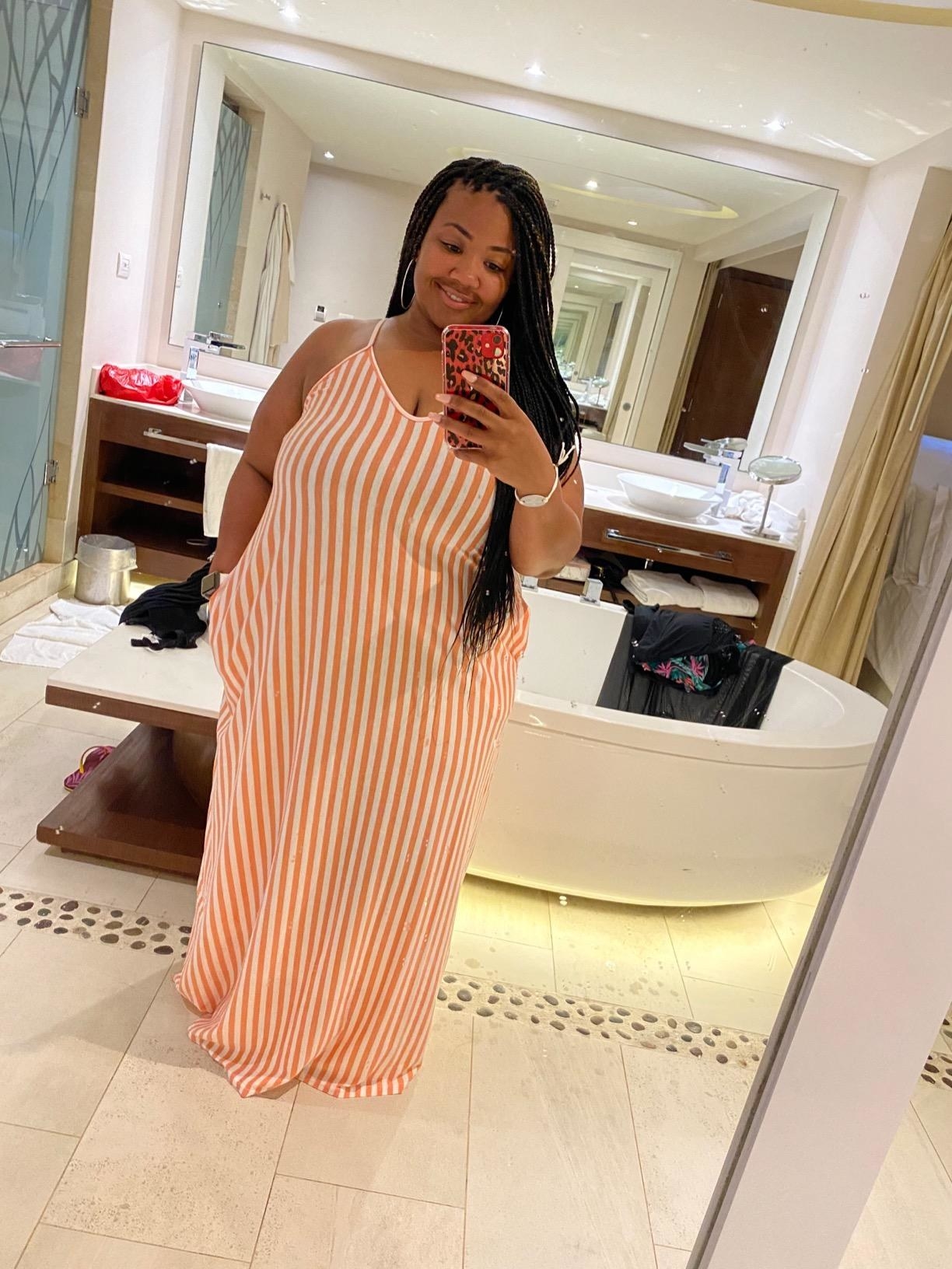 mirror selfie of a plus size reviewer wearing the pink red SheKiss maxi dress