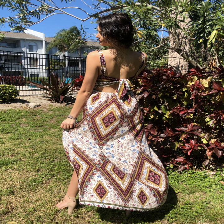 reviewer showing the back of the maxi dress
