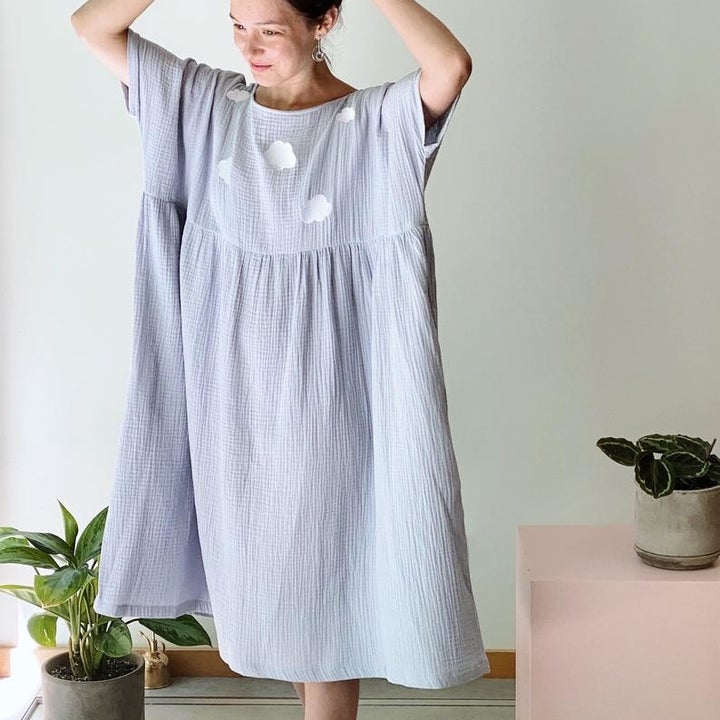 a model wearing the dress in light blue