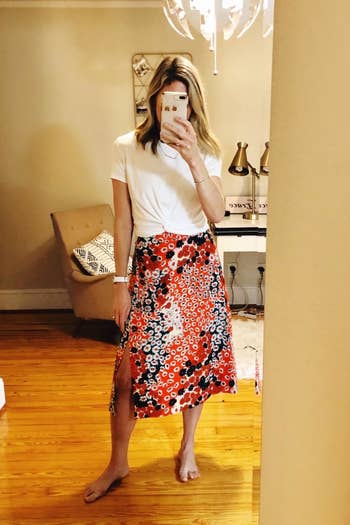a reviewer wearing the skirt in red