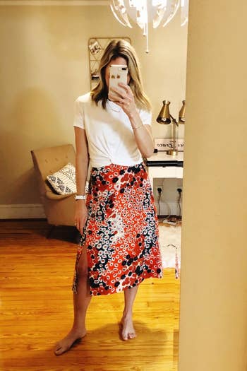 a reviewer wearing the skirt in red