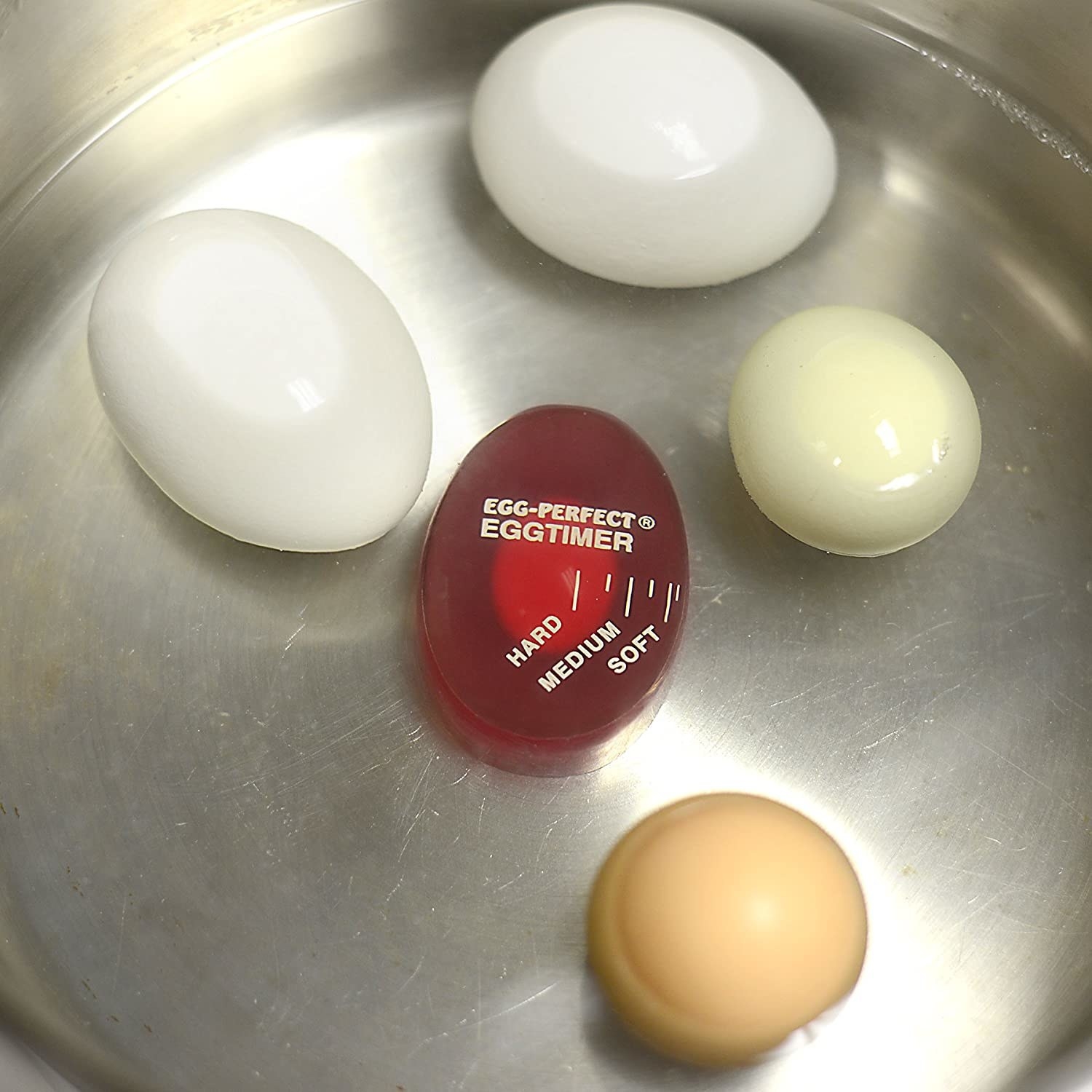 egg shaped timer in a pot with eggs