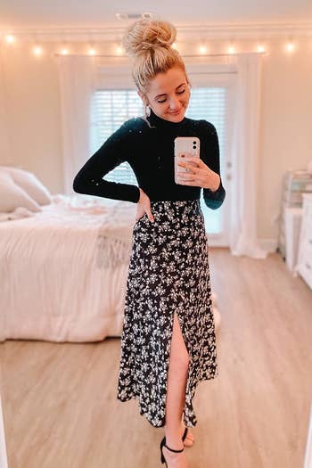 a reviewer wearing the skirt in black and white floral