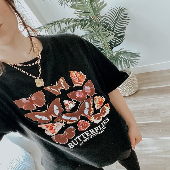 a reviewer wearing the t-shirt in black