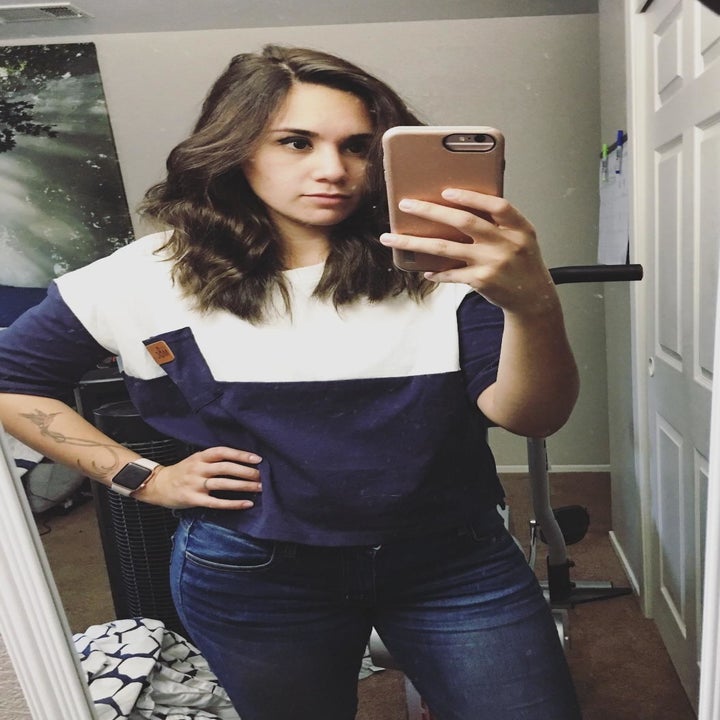 a different reviewer wearing the top in white and navy blue