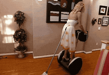 Paris Hilton hilariously mopping while riding an electric stand-up scooter to avoid breaking a sweat 