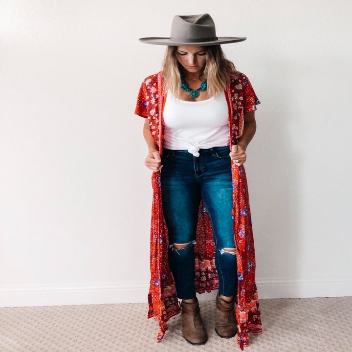 the same reviewer wearing the dress as a duster