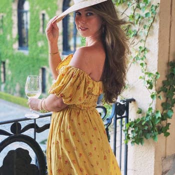 a reviewer wearing the dress in yellow