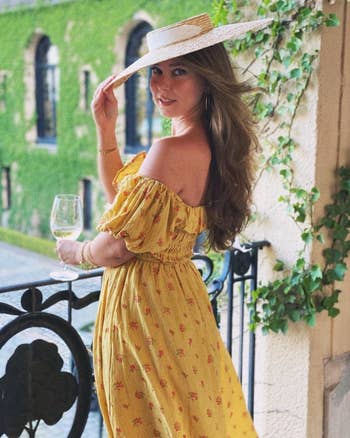 a reviewer wearing the dress in yellow