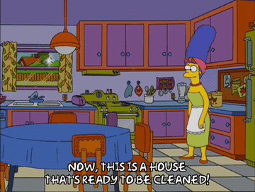 A gif of Marge Simpson saying, &quot;Now, this is a house that&#x27;s ready to be cleaned!&quot; while standing in a sparkling kitchen