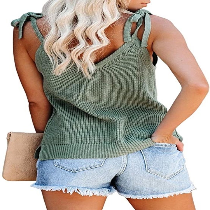 back view of a same model wearing the top in green