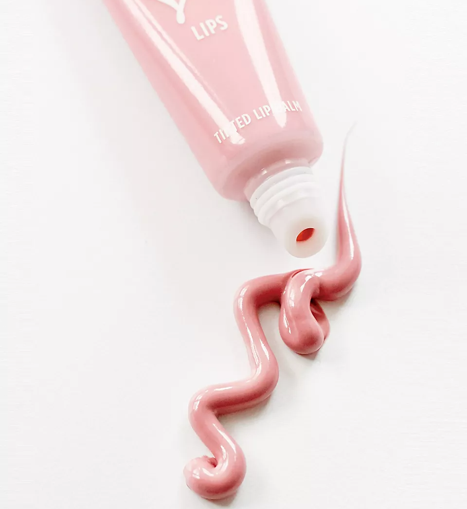 The lip balm with content elegantly squeezed out