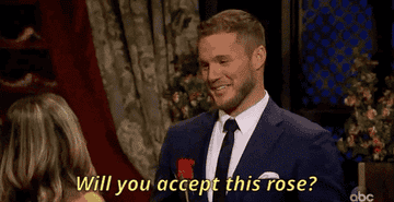 Colton asking a contestant if she will accept his rose 