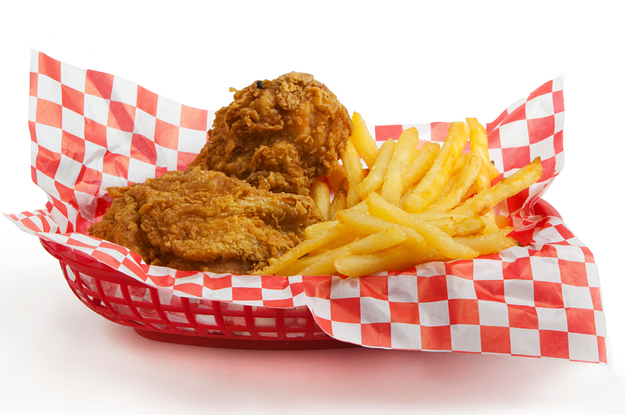 a basket of chicken and fries