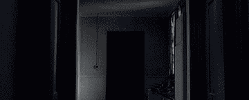 A shadowy figure moving through the halls