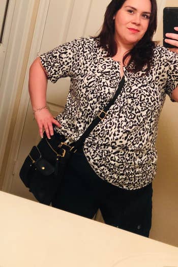reviewer wearing the tunic in leopard print 