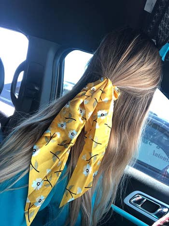 a reviewer wearing the scrunchie in yellow