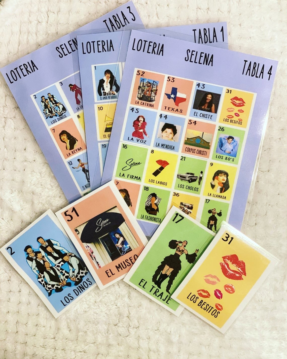 The Selena Loteria game laid out to show the images of the playing cards