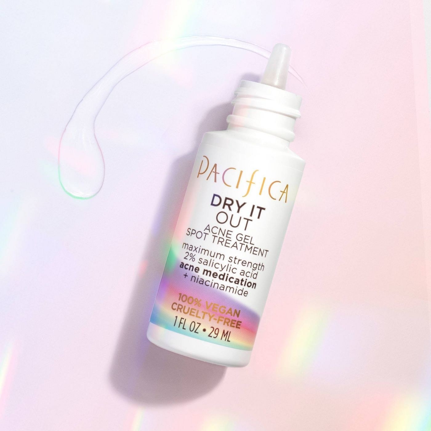 A bottle of acne gel spot treatment on a holographic backdrop