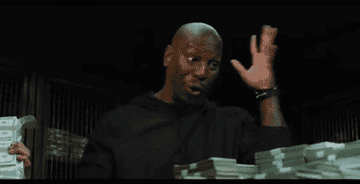 Tyrese makes motions with his hands of bombs exploding around him 