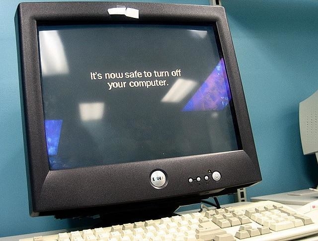 A Dell computer with &quot;it&#x27;s now safe to turn off your computer&quot; written on the screen