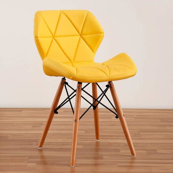 A velour dining chair in yellow