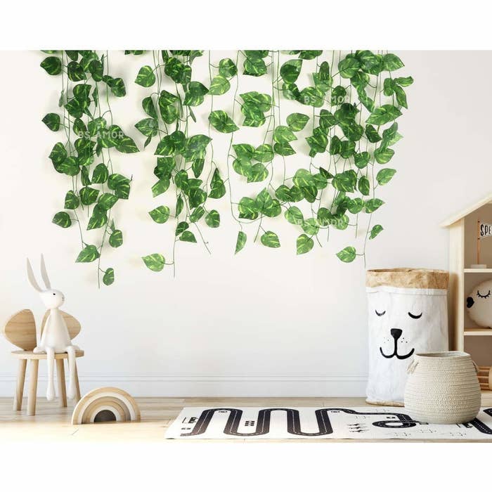 The artificial vines hung up on a wall in a kid&#x27;s room.
