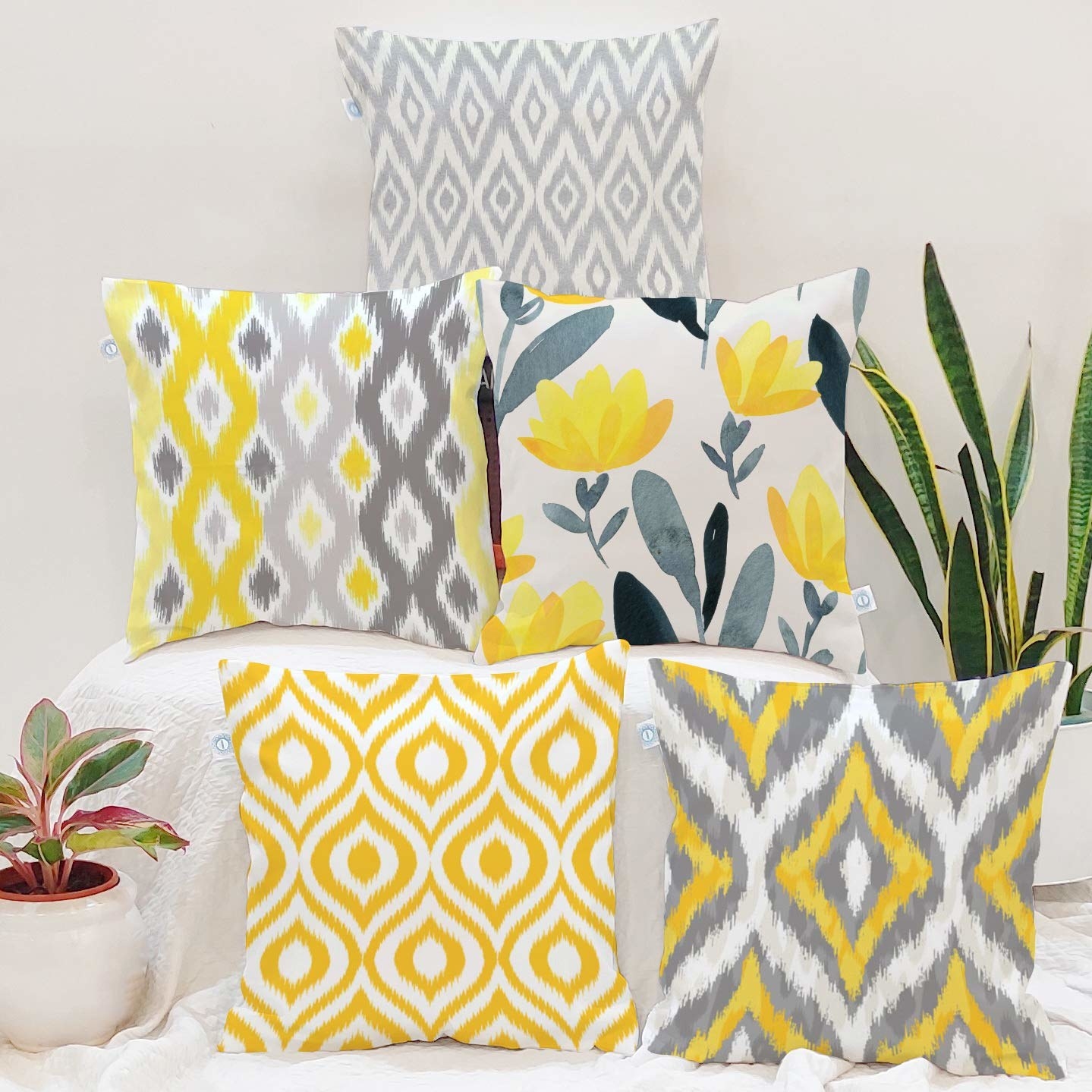 Cushions covers in yellow, white, and grey.