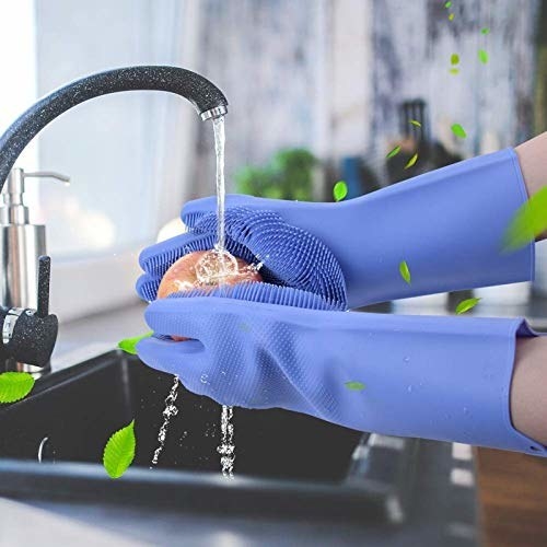 A person doing the dishes with dishwashing gloves 