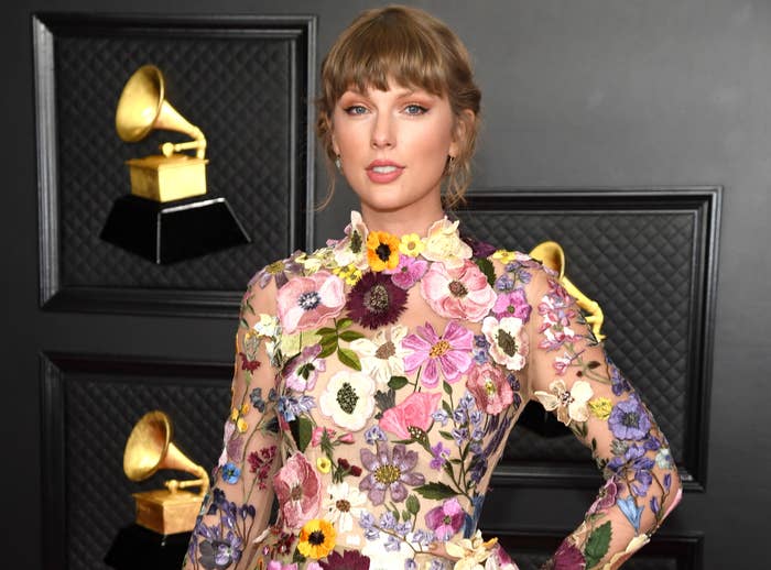 Taylor smiles in a floral dress at a recent event