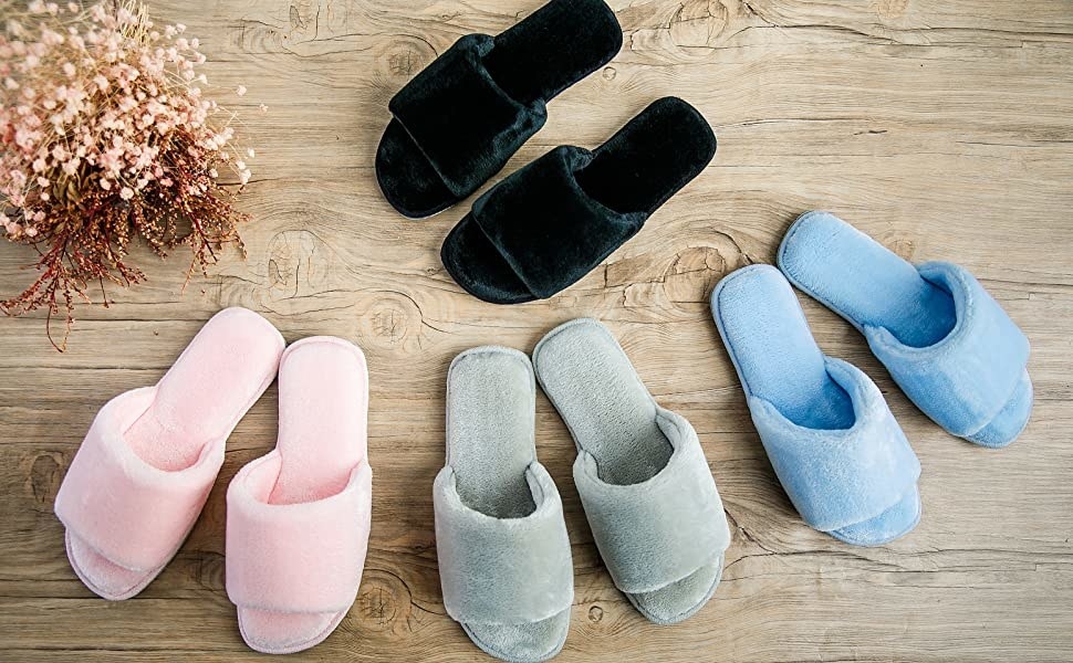 The open toe slippers in black, light pink, grey, and light blue