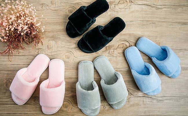 The open-toe slippers successful black, airy pink, gray, and airy blue