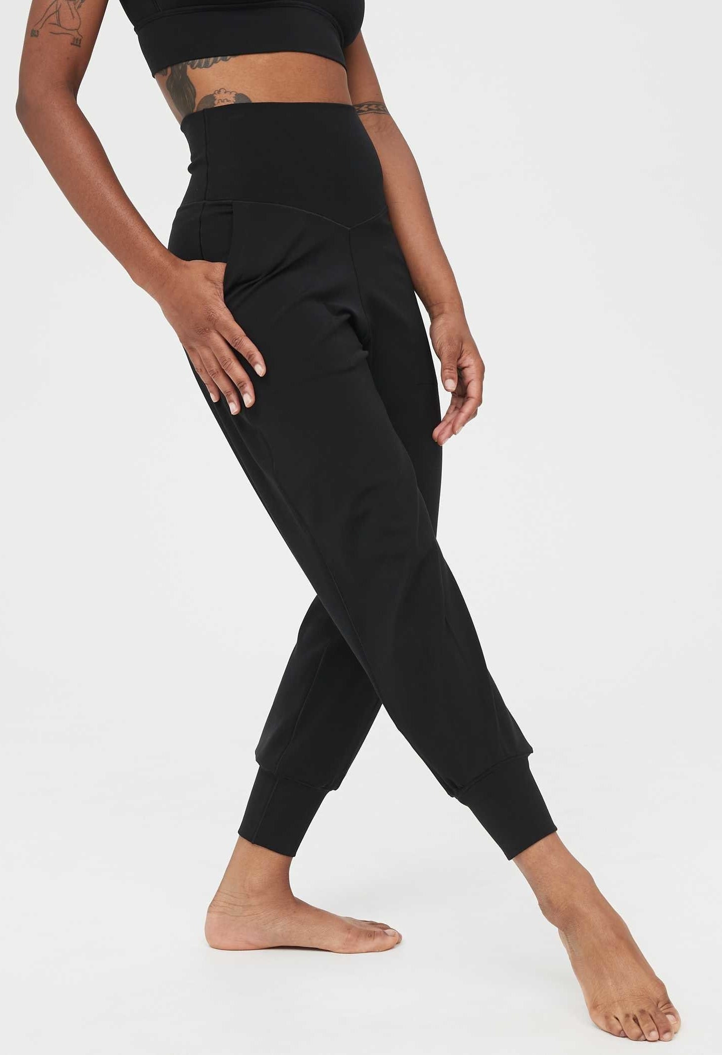 Model wearing the high-waisted joggers in black