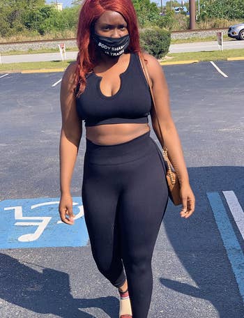 reviewer wearing the black activewear set