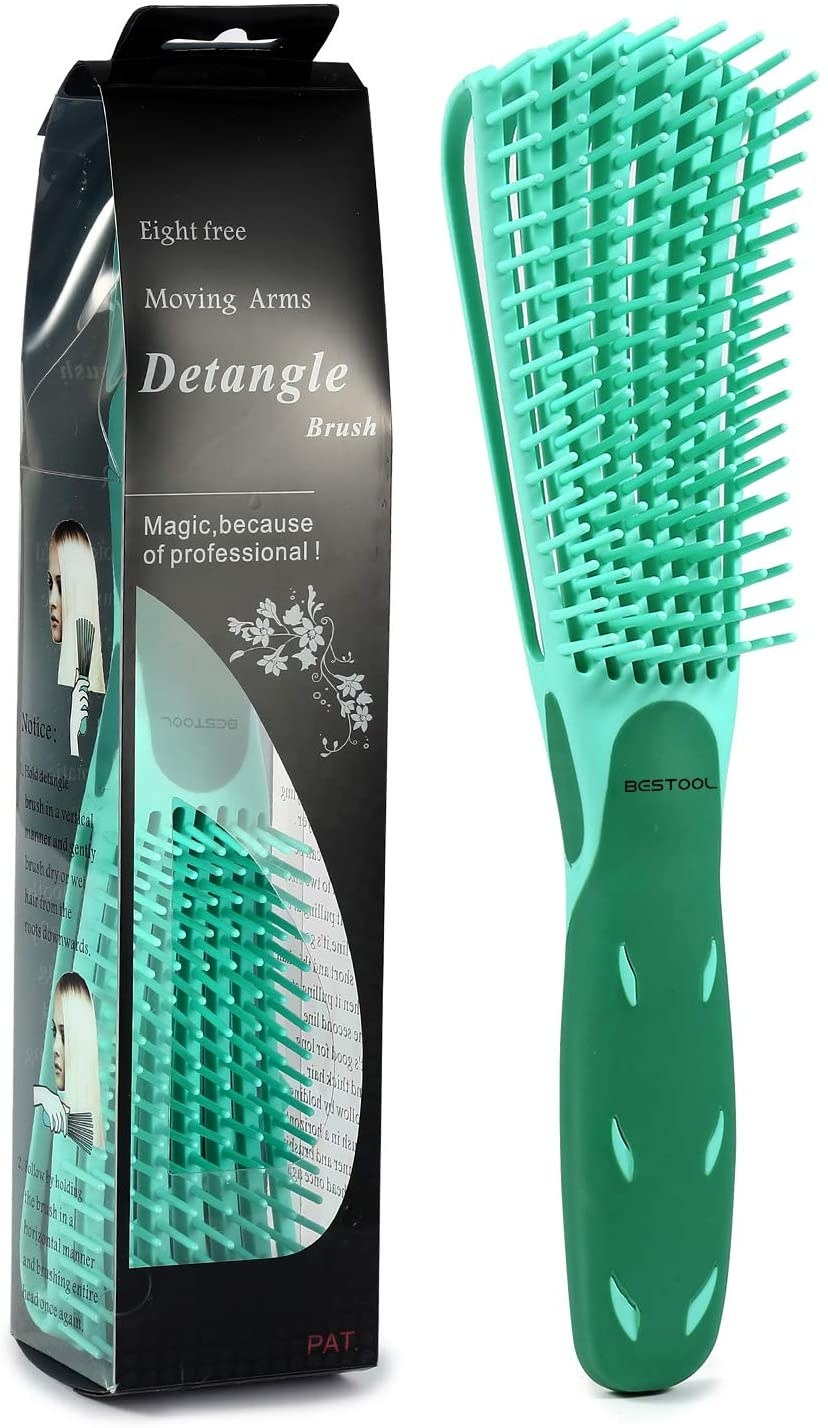 A hair brush with long bristles on a plain background