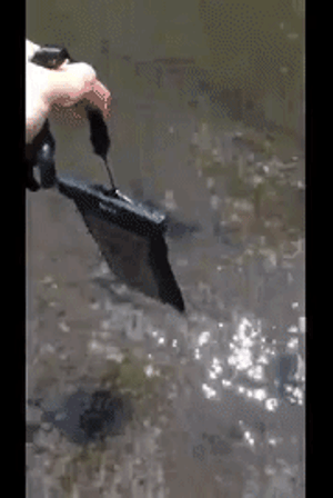 Reviewer dropping phone in the case into a streaming river 