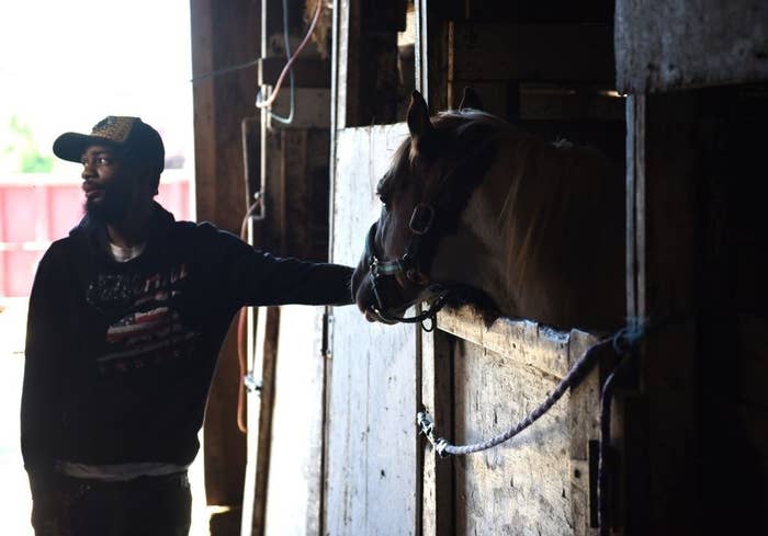 Jamil Prettis with a horse in a stall