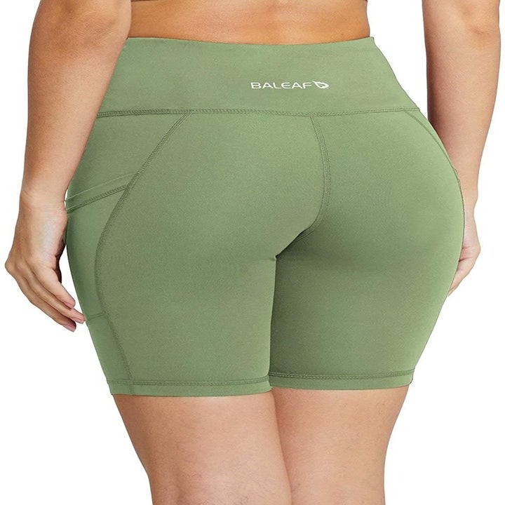 model wearing the green shorts