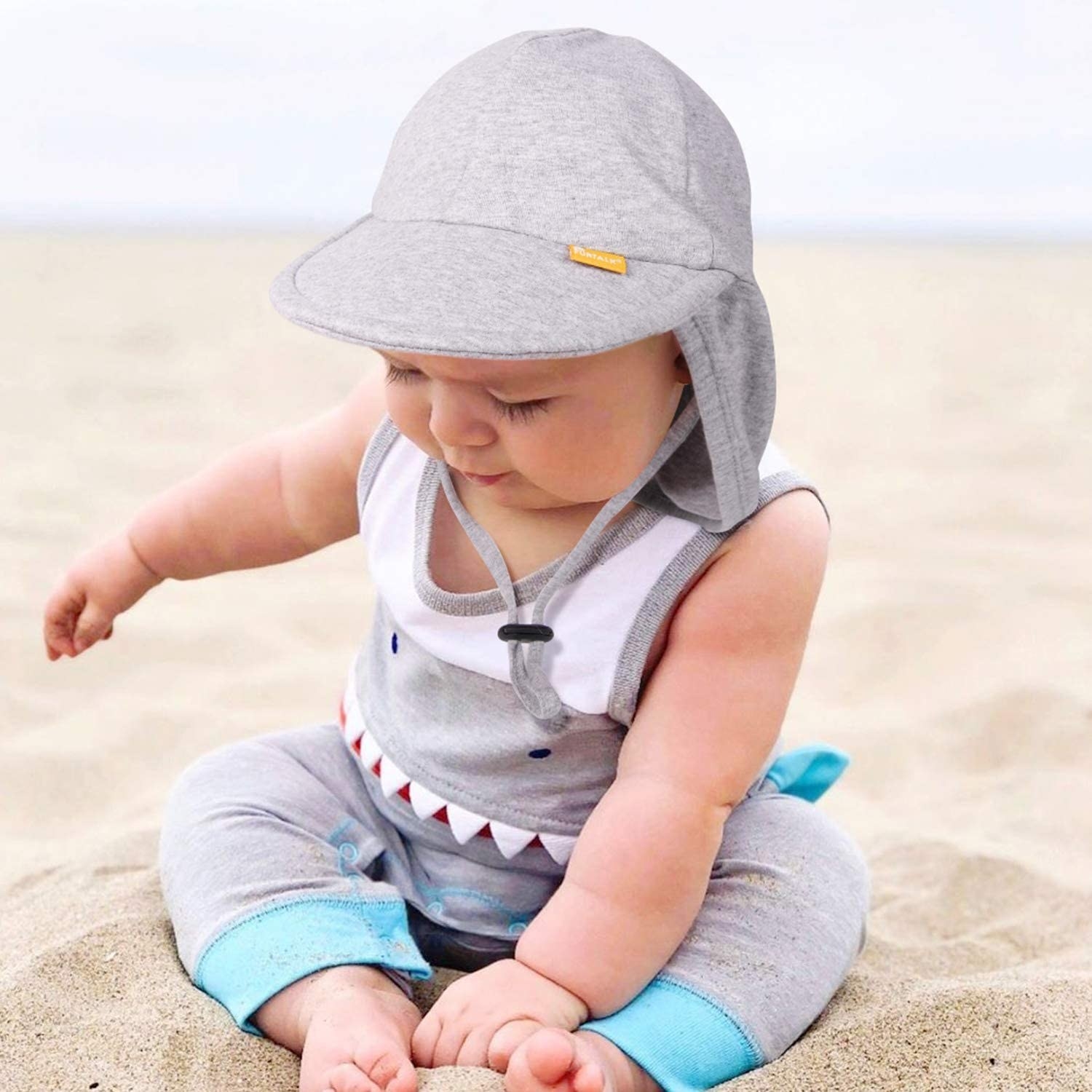 Baby wearing the sun hat in gray 